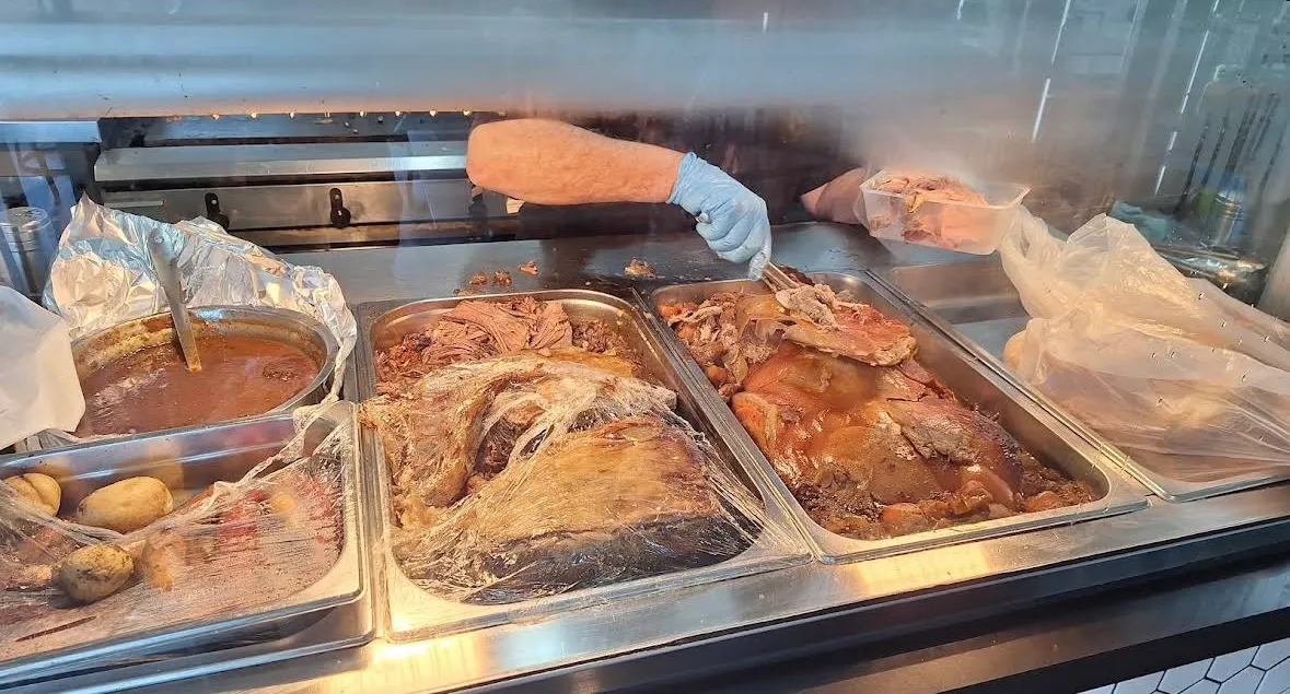 Trays of roast meat and gravy at the counter